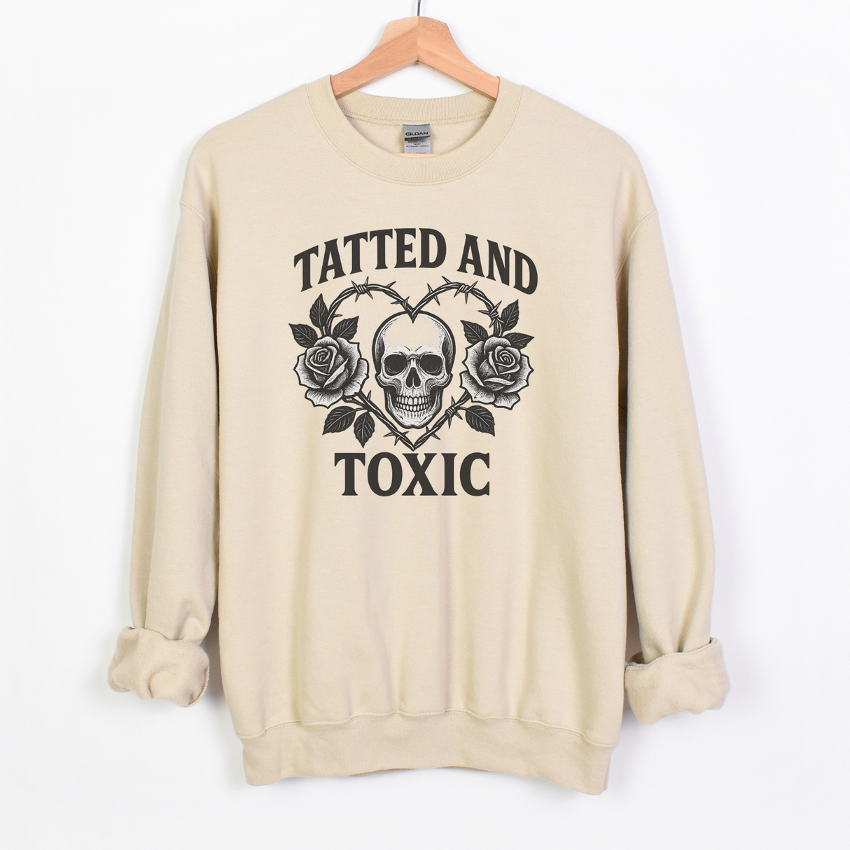 TATTED AND TOXIC WITH SKULL IN CENTER
