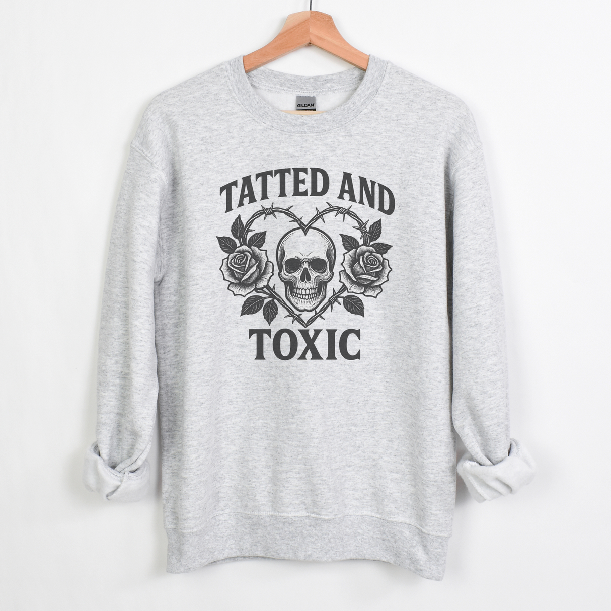 TATTED AND TOXIC WITH SKULL IN CENTER