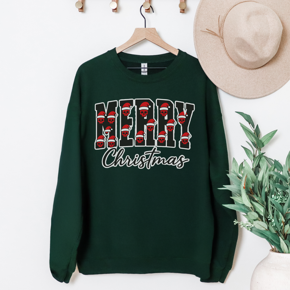 MERRY CHRISTMAS WITH SKULLS WEARING SANTA HATS